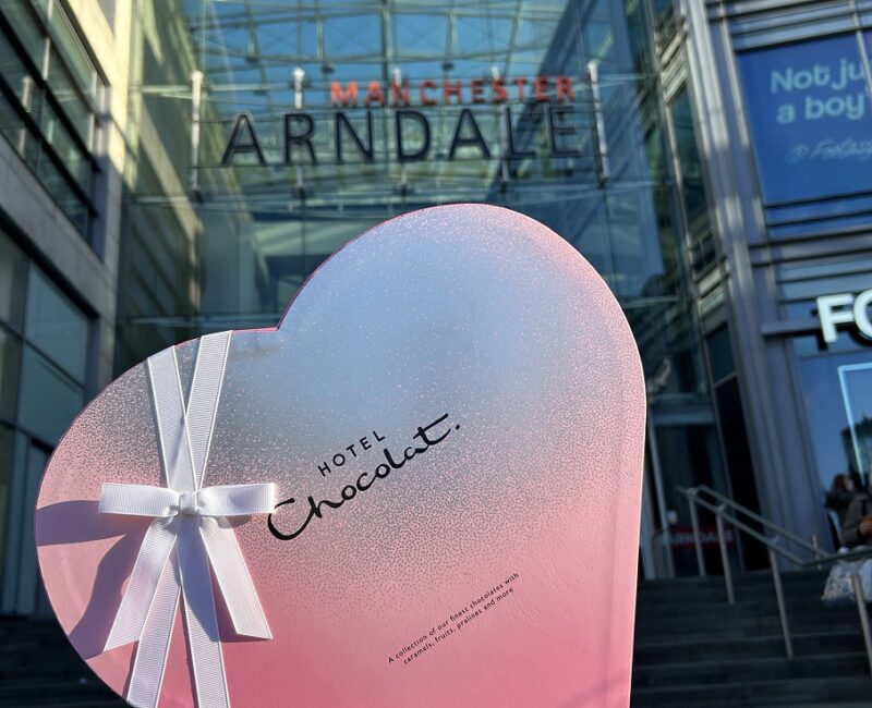 A pink, heart shaped box of chocolates from Hotel Chocolate outside Manchester Arndale