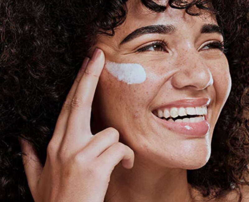 Woman with moisturiser on her face