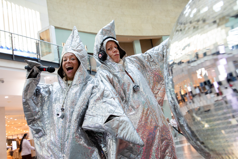 Two people dressed up in silver star costumes
