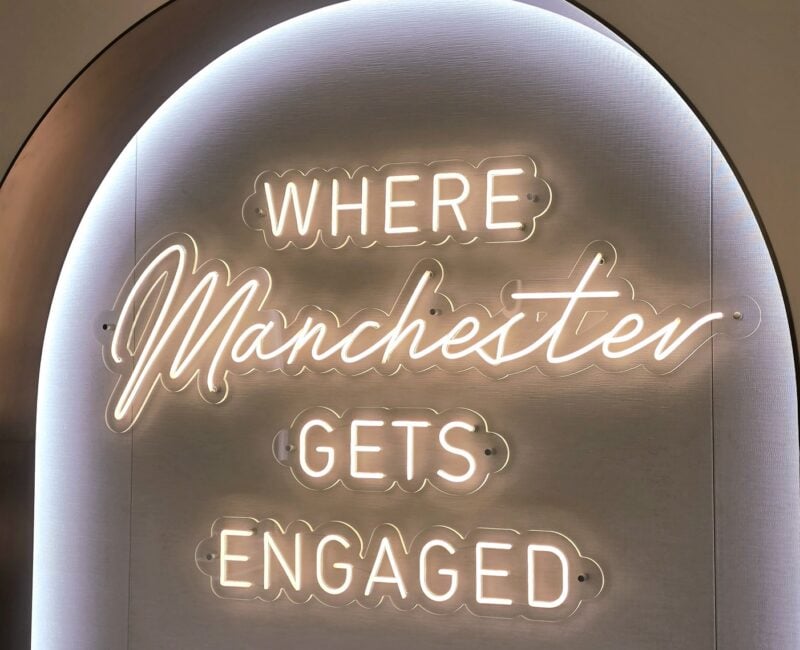 Neon sign saying "where Manchester gets engaged"