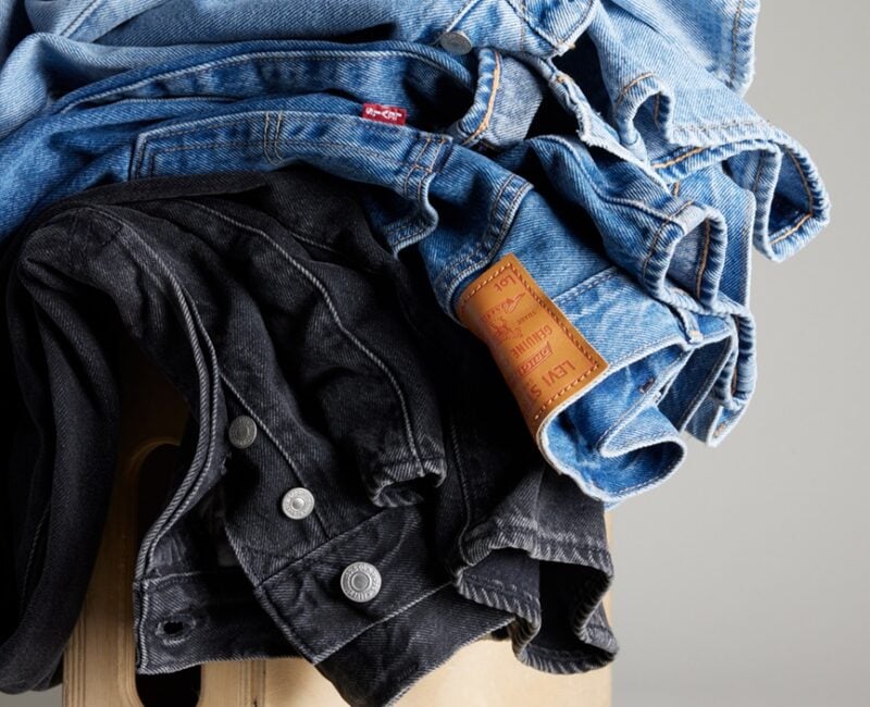 Levi's jeans folded over a wooden block