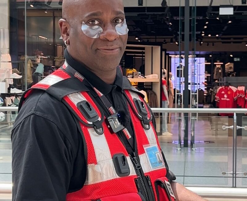 A Manchester Arndale Security Guard with eye patches on